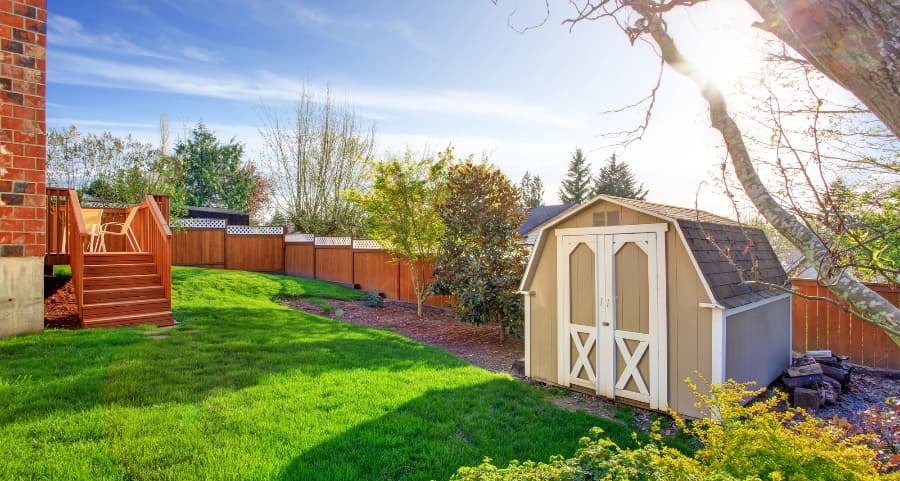 Fenced backyard with storage shed in Charlotte